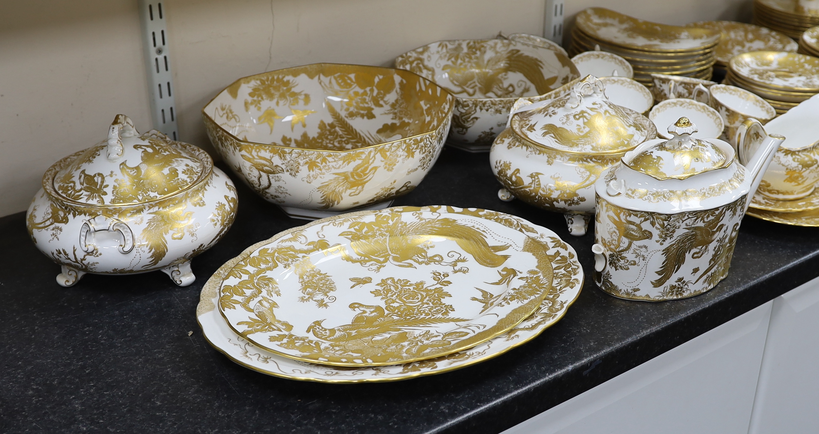 An extensive Royal Crown Derby Gold Aves dinner and tea service